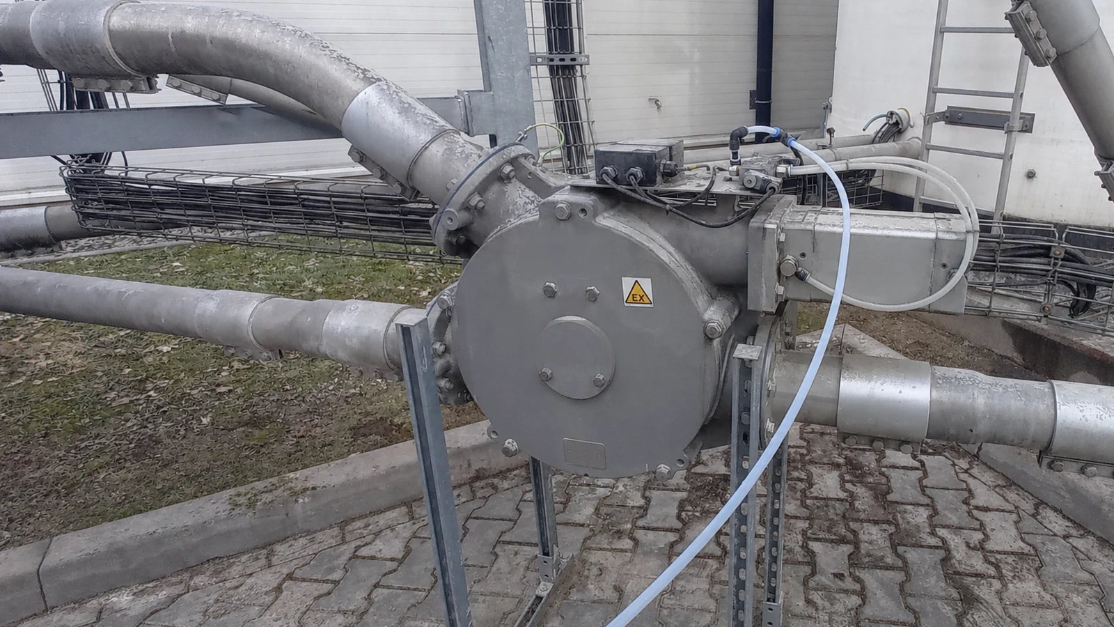 Pneumatic conveying diverter inspected in a combustible-dust installation.